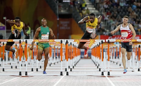 Jamaica’s Ronald Levy, left, and teammate Hansle Parchment, second right in action during the final.