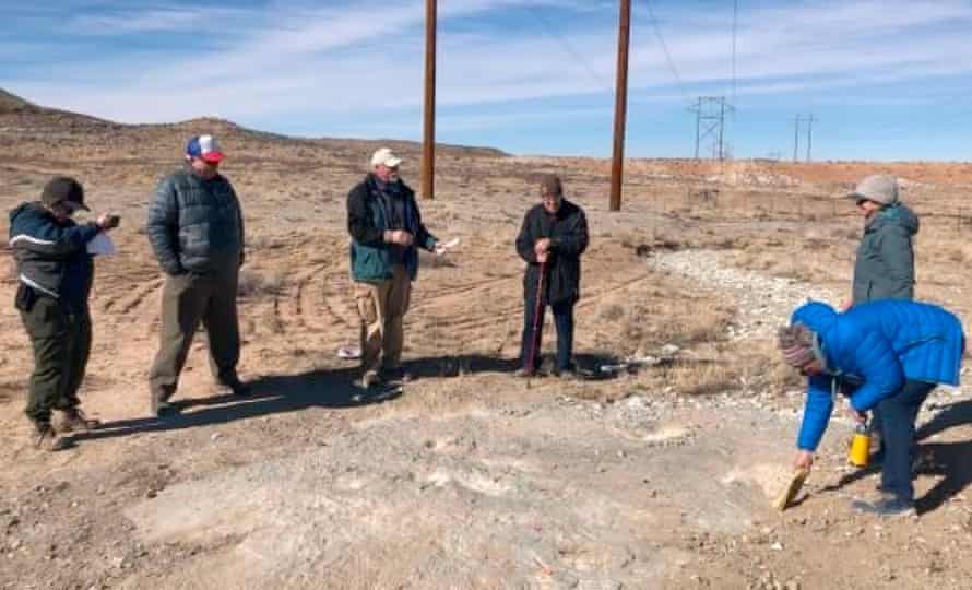 Inspectors from the Bureau of Land Management examine damage to the Mill Canyon Dinosaur Track site.