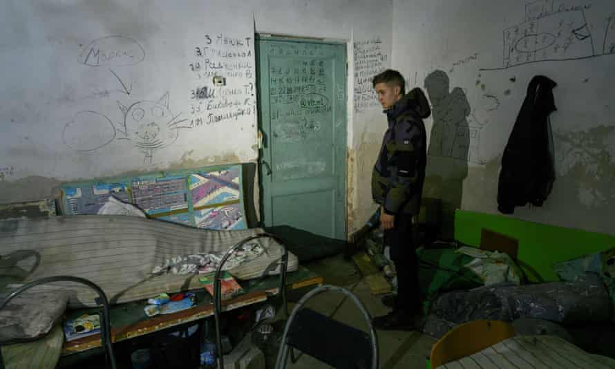 A local resident Vladyslav, 17, shows a basement of a school, where he spent 28 days during Russia’s invasion, in the village of Yahidne, Ukraine.