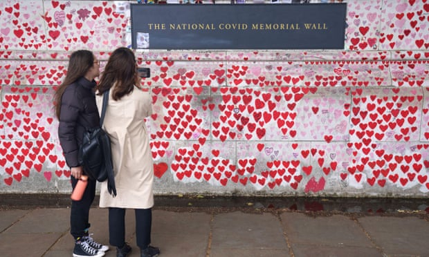 People at the Covid memorial wall in London