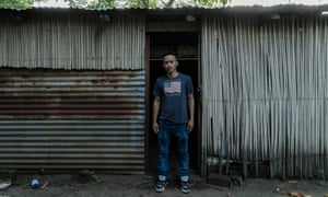 Arnovis Guidos Portillo outside his house in Usulatan, which is ruled by gangs.
