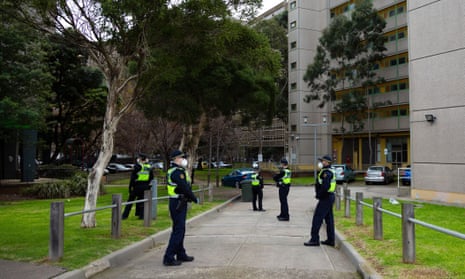 Police outside a locked down housing block in North Melbourne in July 2020