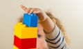 A child playing with toy building blocks