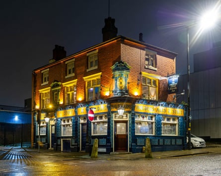 A traditional pub lit up at night