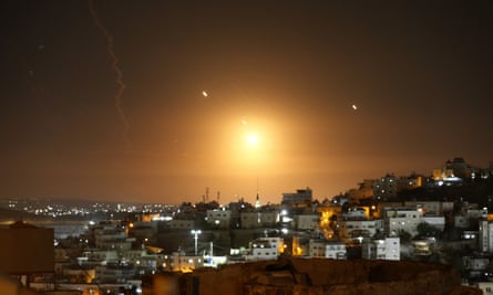 Iranian rockets fired into Israel are seen over Jerusalem from Hebron, West Bank on 1 October.