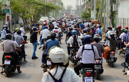 Motorcycle riders protest in Mandalay for an end to the military junta.