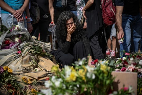 Relatives and friends of David Carroll, killed by Hamas on 7 October in kibbutz Beeri, mourn during his funeral in Revivim.