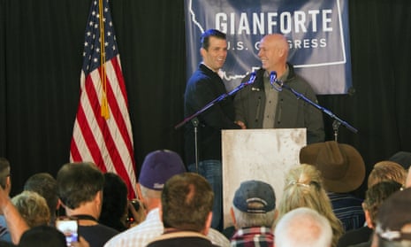 FILE- In this May 11, 2017 file photo, Republican Greg Gianforte, right, welcomes Donald Trump Jr., the president’s son, onto the stage at a rally in East Helena, Mont. Gianforte, a businessman, kept Trump at arm’s length when he unsuccessfully ran for Montana governor on the GOP ticket last year. Now he’s wholeheartedly embracing his party’s president in his race for the state’s open congressional seat. (AP Photo/Bobby Caina Calvan, File)
