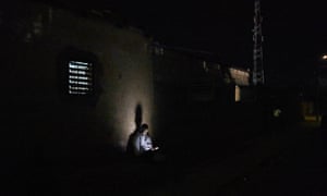 A man in Podor, Senegal, with a mobile phone