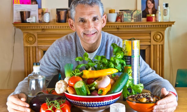 Professor Tim Spector at home with an overflowing bowl of vegetables