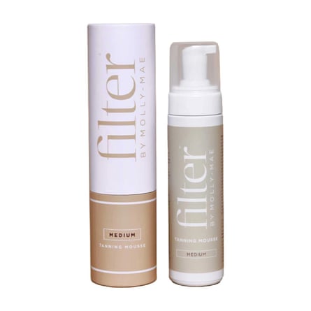 A bottle of Filter by Molly-Mae Tanning Mousse next to its tube packaging.