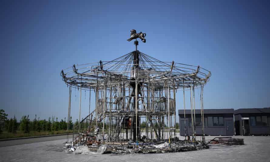 The remains of a children’s carousel that was destroyed during the Russian invasion stands forlornly in the grounds of Dobropark, a children’s theme park on the outskirts of Kyiv