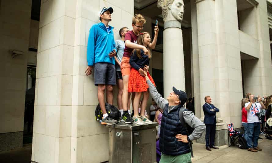 The family of Toni Vainio (bottom with baseball cap) watch the proceeding at St. Paul’s People and Crowds gather at the Queen’s Jubilee Service of Thanksgiving at St. Paul’s Cathedral in London.