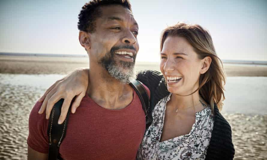 Happy couple on the beach.