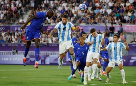 Jean-Philippe Mateta rises high to head France into an early lead.