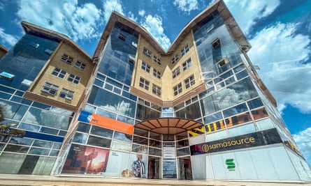 People walk outside the building that houses Samasource in Nairobi, Kenya