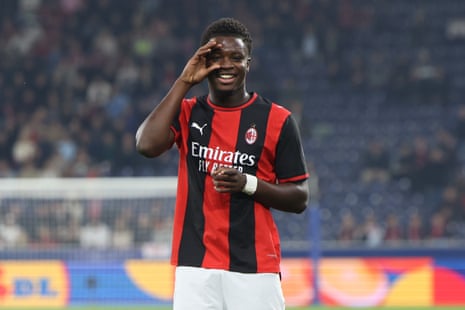 AC Milan's Alphadjo Cisse smiles, framing his eye with his hand after scoring