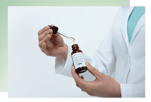 Dr Emma Craythorne holds a bottle of SkinCeuticals Silymarin CF serum