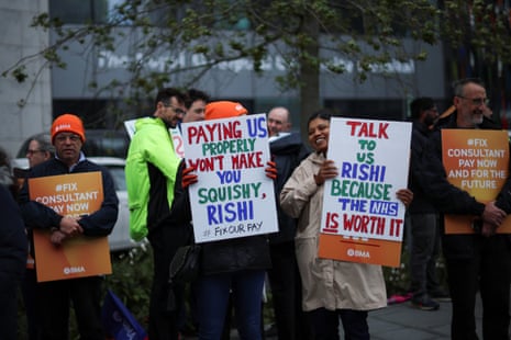 Hospitals consultants on a picket line outside the Royal Liverpool University Hospital in Liverpool this morning, as part of the England-wide strike.