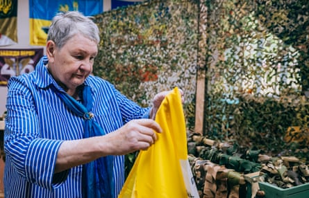 A woman making camouflage nets at a centre in Zaporizhzhia for displaced Ukrainians.