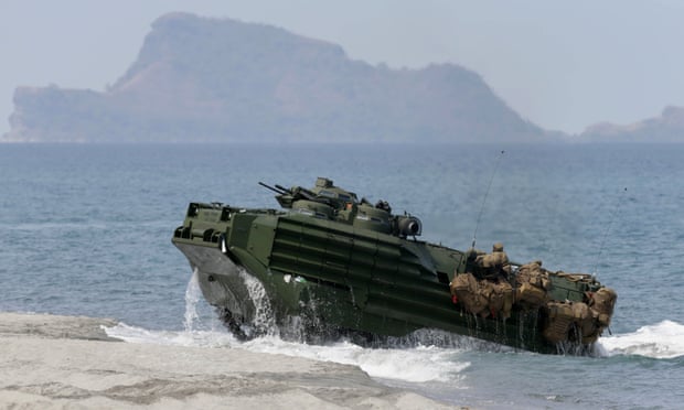 A 2015 exercise in the South China Sea: Philippine and US troops on board a US navy amphibious assault vehicle close to the disputed Scarborough Shoal. Photograph: A 2015 exercise in the South China Sea: Philippine and US troops on board a US navy amphibious assault vehicle close to the disputed Scarborough Shoal. Photograph: