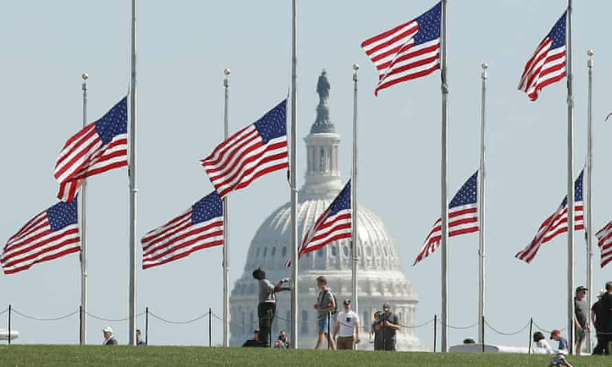 Flags on the grounds of the Washington Monument lowered to half-staff.