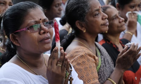 Relatives of victims of last week’s bomb blasts say prayers at Katuwapitiya church, Colombo, Sri Lanka