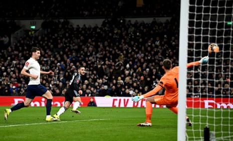Aston Villa's Emiliano Buendia smacks the ball past Spurs keeper Guglielmo Vicario to open the scoring.