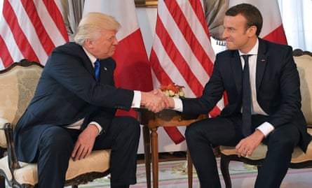 May 25, 2017 US President Donald Trump (L) and French President Emmanuel Macron (R) shake hands ahead of a working lunch, at the US ambassador’s residence, on the sidelines of the NATO (North Atlantic Treaty Organization) summit, in Brussels.