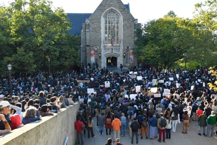 Demonstrators listen to a speaker during a protest on 5 October 2026, in Ithaca, New York.