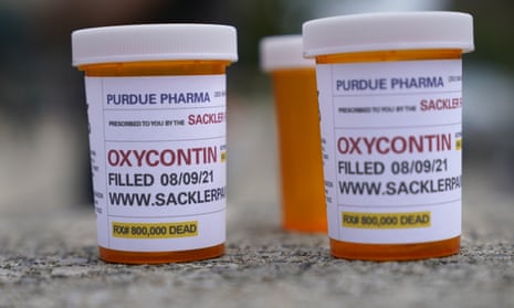 Fake pill bottles with messages about Purdue Pharma are displayed during a protest outside the courthouse where the bankruptcy of the company is taking place in White Plains, New York.