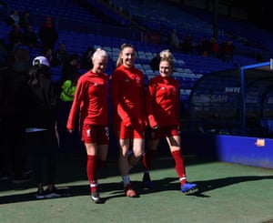 Ashley Hodson, Niamh Charles and Laura Coombs of Liverpool walk out.