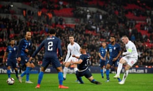 Wayne Rooney shoots a shot on goal in his last match in England.