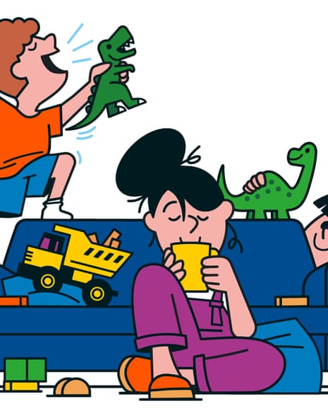 Children playing on the sofa while their mum sits on the floor and drinks a cup of tea