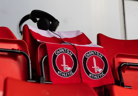 “Headphone Norm’s” seat at Charlton on Tuesday, with headphones on top of two club scarves.