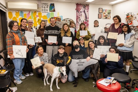 Josh Nicholas (centre back) and the other life drawing participants show off their sketches.