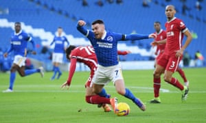 Liverpool’s Neco Williams brings down Brighton’s Aaron Connolly in the box.