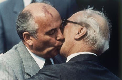 Gorbachev, left, and East Germany's state and Communist party leader Erich Honecker exchange kisses at East Berlin's Schoenefeld airport on May 27, 1987.