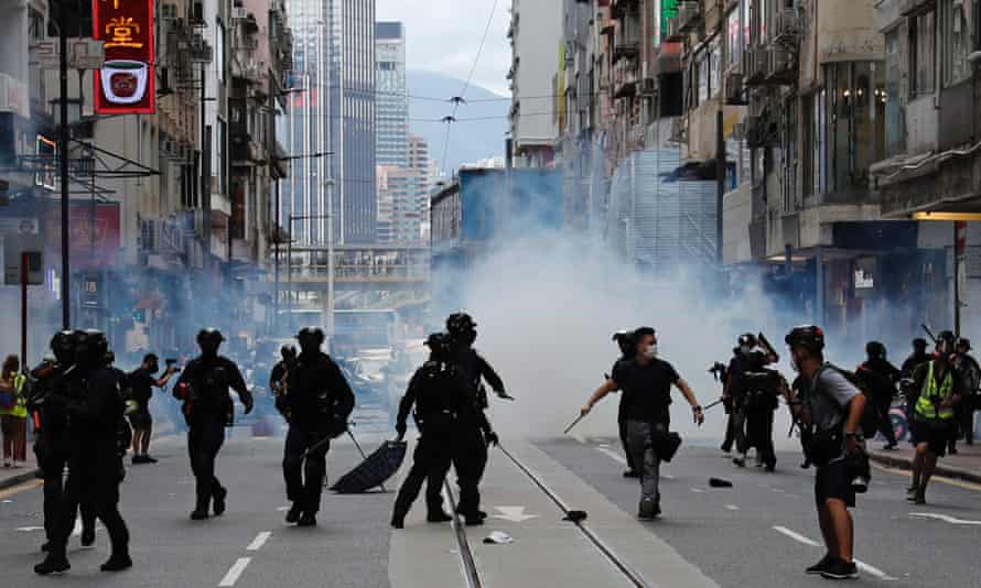 Riot police fire tear gas to disperse anti-national security law protesters.