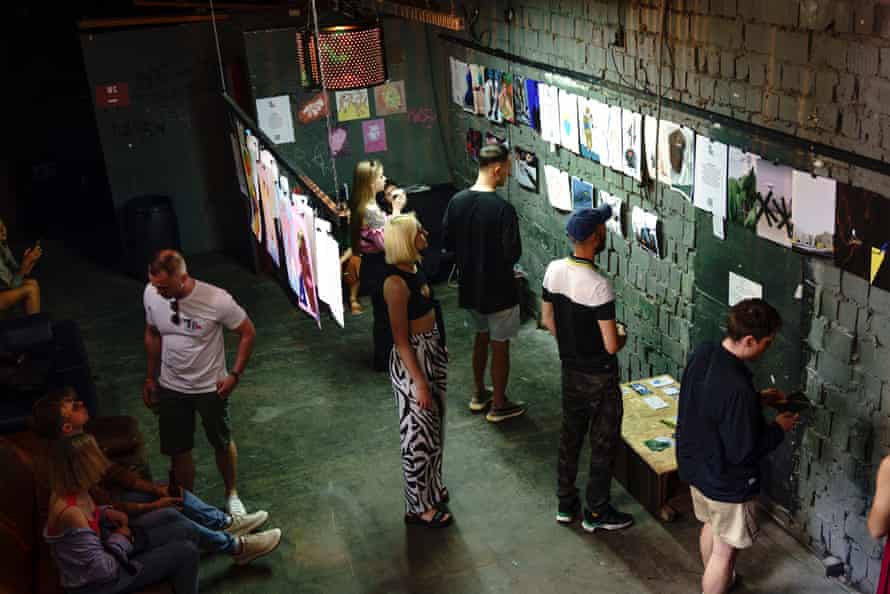 Visitors check out some of the many ribbon factory artworks on display at On Time festival.