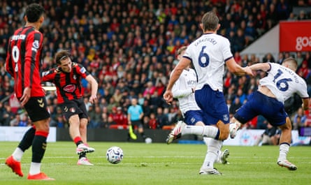 Alex Scott shoots from just inside the penalty area for Bournemouth as Everton players try to block