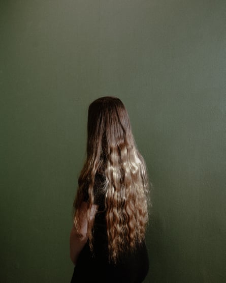 A young person with long hair