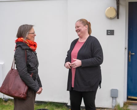 The two women chatting on a doorstep