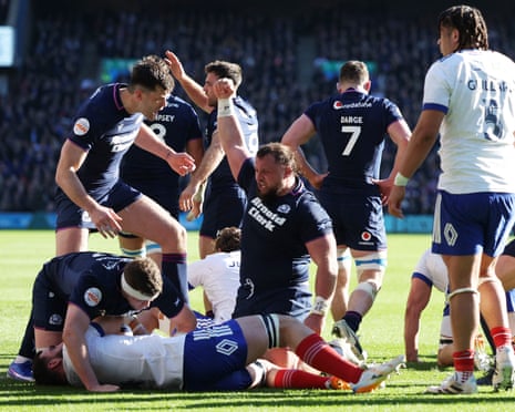 Scotland's Pierre Schoeman celebrates scoring a try against France at Murrayfield