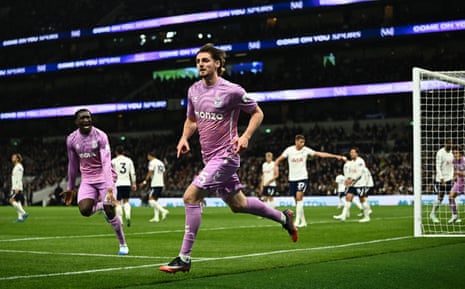 Jack Rudoni celebrates scoring for Coventry City, pointing to his wrist on the pitch