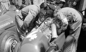 Mechanics inspect the Alfa Romeo 158 driven to third place by Britain’s Reg Parnell.