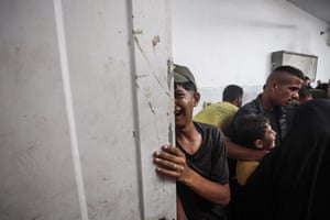 People attend a funeral ceremony in Gaza