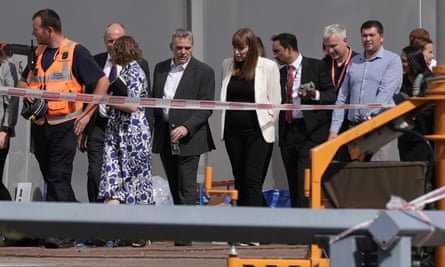 Angela Rayner and a large group of people stand along a cordoned-off walkway