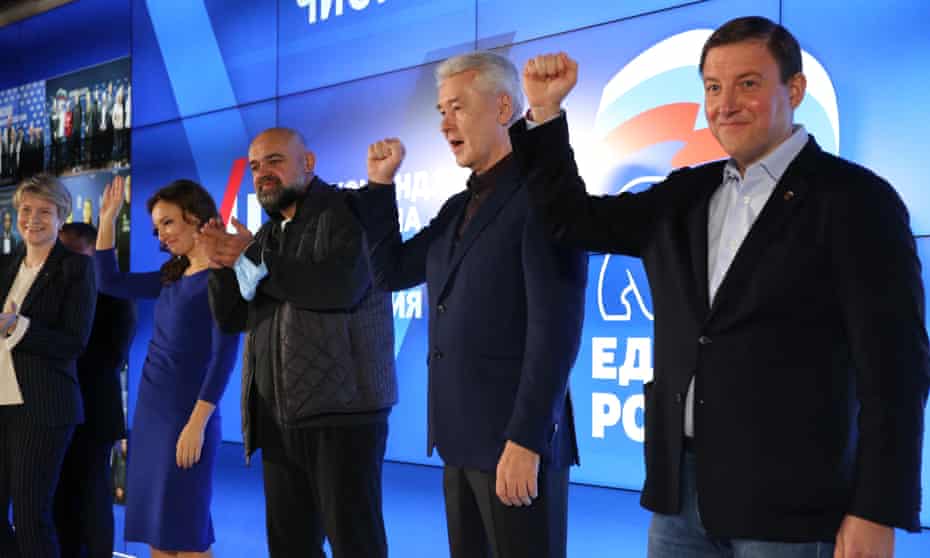 Members of the pro-Putin United Russia party greet supporters. Despite its win, polls show a weaker performance than the last parliamentary election held in 2016.