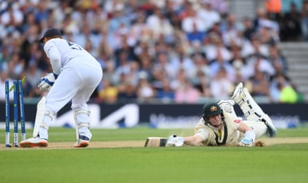 Steve Smith dives to make his ground and survives the tightest of run-out calls